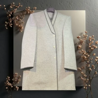 White handmade Chitrali wool cloak traditional long coat artisan crafted Chitral Pakistan natural organic winter wear