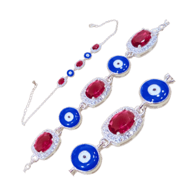 Heritage silver bracelet with ruby and evil eye protection symbols, handcrafted by artisans in Chitral's mountain communities